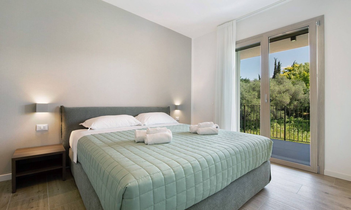 Garda Apartment | Apartment 'Eleonora C1' with Shared Pool, Private Terrace, and Air Conditioning
