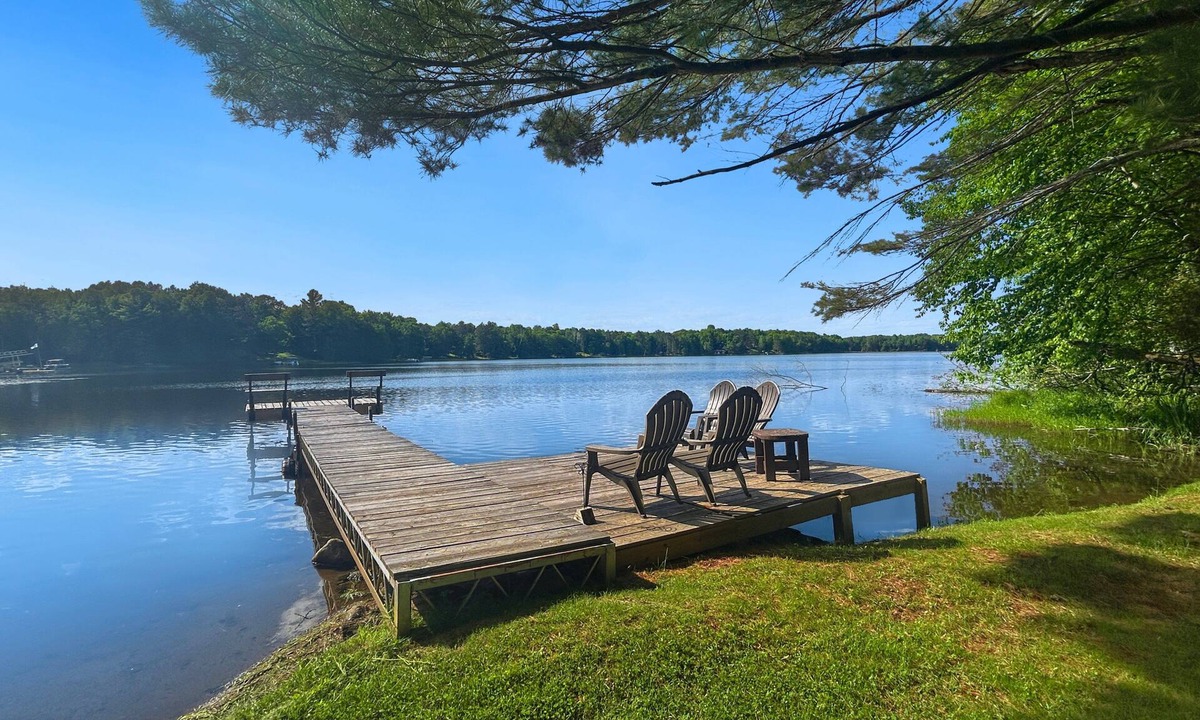 Butternut Ski Chalet | Lakefront 3BR, 2BA cottage with dock, boat, and fire pit