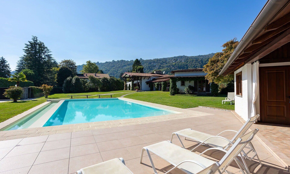 Solcio Villa | My Rental Homes - Villa Brin with tennis court, private sandy beach and dock