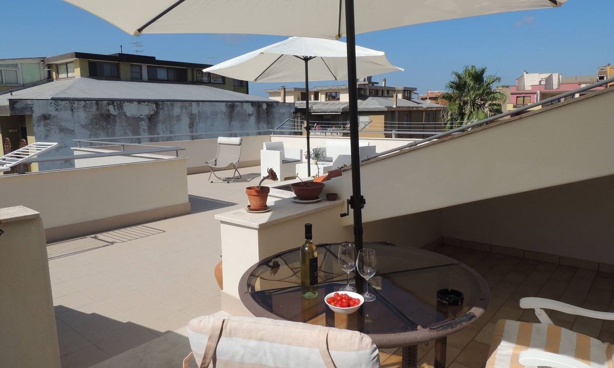 Oristano Apartment | Top floor penthouse apartment with terrace in the historical center, 3 km from the beach