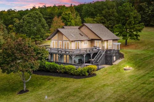 Livingston House | Updated lakefront home & studio with water views, hot tub, dock & game room