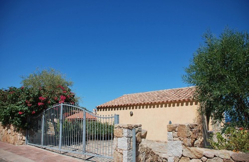Porto San Paolo Apartment | Bouganville apartment on villa with garden facing Tavolara Island