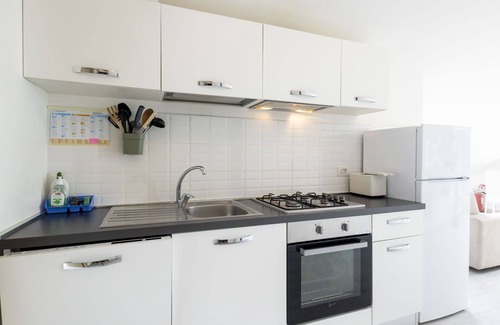 Meina Apartment | Cosy apartment for 4 guests with pool, A/C, TV and balcony