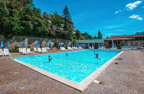 Susello Apartment | 2-room corner apartment with sunny balcony in a residence with pool