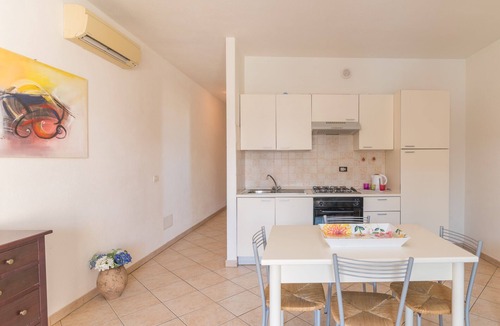Santa Teresa di Gallura Apartment | Accessible Holiday Apartment 'Borgo Dei Mitri 27' with Garden, Terrace & 2 Pools