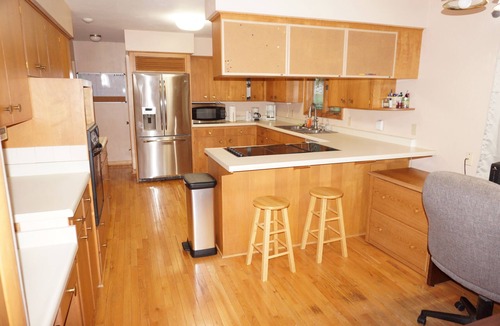 Urbandale House | Acreage InTown 4 BR, 2 Bath 3,300 sq ft half house option with gymnasium.