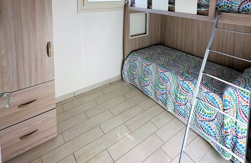 Badesi Apartment | Attic three-room apartment with panoramic sea view, shared swimming pool and parking space