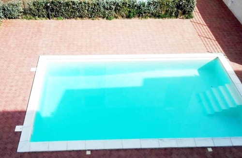 Badesi Apartment | Attic three-room apartment with panoramic sea view, shared swimming pool and parking space
