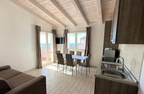 Badesi Apartment | Attic three-room apartment with panoramic sea view, shared swimming pool and parking space
