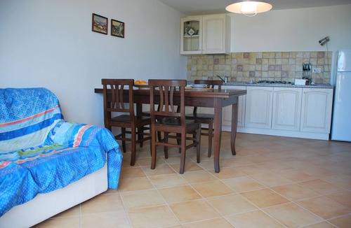 Porto San Paolo Apartment | Bouganville apartment on villa with garden facing Tavolara Island