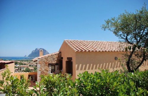 Porto San Paolo Apartment | Bouganville apartment on villa with garden facing Tavolara Island