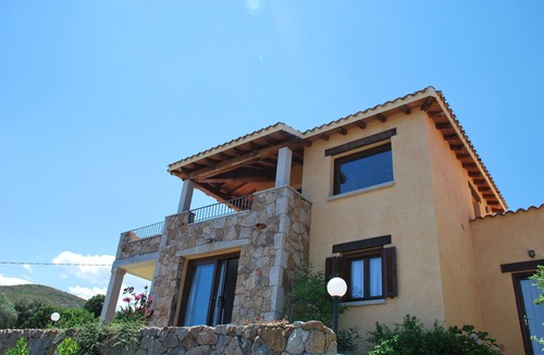 Porto San Paolo Apartment | Bouganville apartment on villa with garden facing Tavolara Island