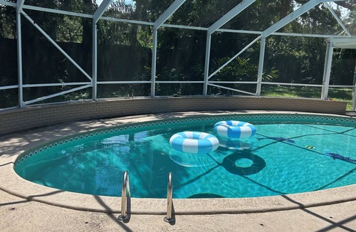 Fort Pierce House | Bright spacious beautifully designed pool home with fireplace fast wifi sleeps 8