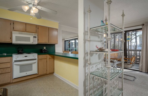North Ocean City Condo | Charming 2 bed 2 bath condo featuring the ultimate private setting with wooded views that you can enjoy from your spacious deck.