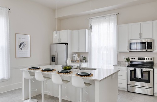 Issue House | Coastal Charm and Convenience: Luxurious 5-Bedroom Just Steps From Downtown