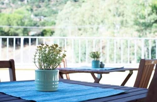 Guspini House | Comfortable room with private balcony and view