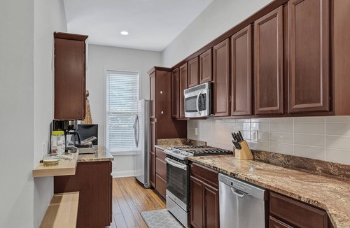 Old Goucher House | Elegant 3 bedroom Row Home Beside the Park High Ceilings, Natural Light & Views.