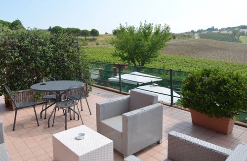 Passano Apartment | Garden-View Apartment in Coriano Italy with Swimming Pool