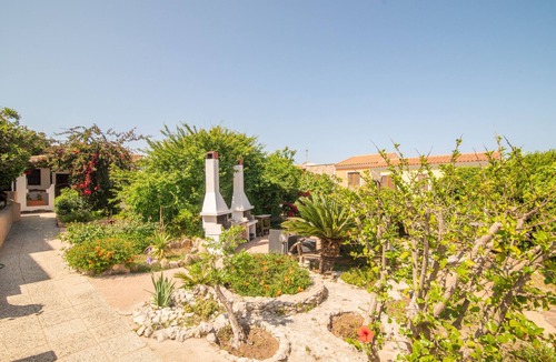 Capo Testa Apartment | Holiday Apartment 'Agostino' close to the Beach with Shared Terrace, Shared Garden & Wi-Fi