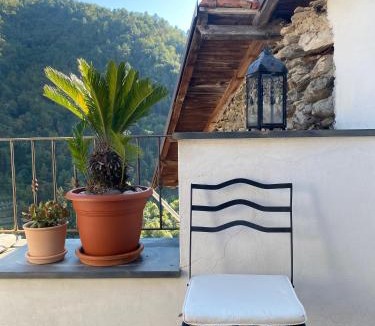 Pigna Villa | Iconic Italian Townhouse w Rooftop Terrace & Mountain View, Pigna