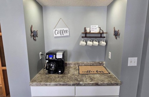Marion House | Lake Front home Sleeps 10 Overlooking deck for perfect lake views & a coffee bar