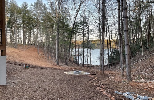 Nebo House | Lake front home with dock in a small cove with a beach.