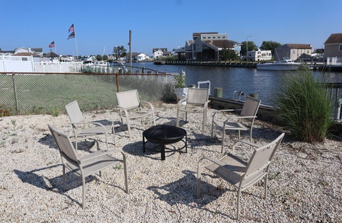 Mystic Island House | New! Spacious 4-Bedroom, Sleeps & Seats 12, Waterfront in Little Egg Harbor