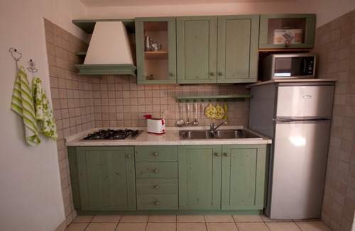 Monte Petrosu Apartment | Nice apartment with roof terrace in an elegant complex with swimming pool