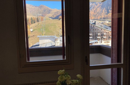 Foppolo Apartment | Panorama of Foppolo, the mountains and the slopes in the morning sun