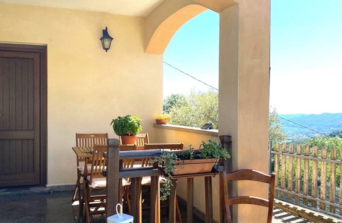 Sanfront House | Panoramic two-story dwelling with private garden, surrounded by green woods.