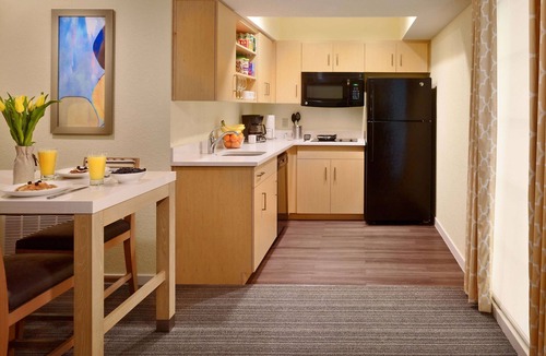 Somerset Hotel | Relax in Spacious Suite with Full Kitchen and Seasonal Swimming Pool