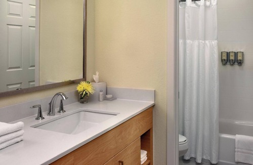 Somerset Hotel | Relax in Spacious Suite with Full Kitchen and Seasonal Swimming Pool