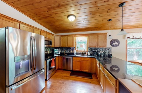 Bloomington House | Spacious forest retreat with grill, firepit, game room, & jacuzzi tub - dogs ok
