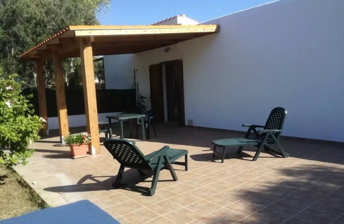 Calasetta Cottage | Studio apartment with patio in front and back terrace with veranda