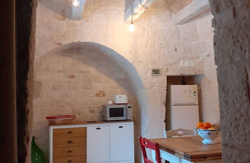 Alberobello House | Trullo surrounded by nature with a beautiful view a stone's throw from the center