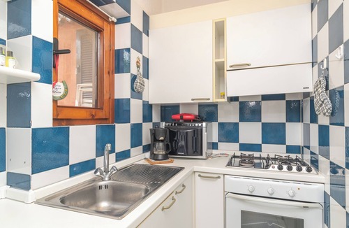 Punta Sardegna Villa | Villa Ari with Sea View, Garden and Shared Pool