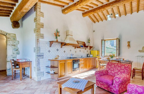 Radicondoli Apartment | Welcome to this charming stone house with shared pool and panoramic views of beautiful surroundings.