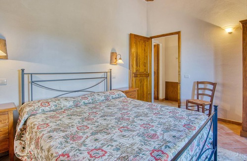 Radicondoli Apartment | Welcome to this charming stone house with shared pool and panoramic views of beautiful surroundings.