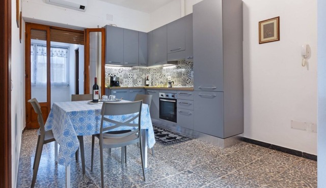 A cozy and spacious 80 square meters apartment, perfect for four people, located on the first floor of a typical Sant'Antioco building (NO elevator).The property is located a short distance from the town center and offers quick access to the seafront. It