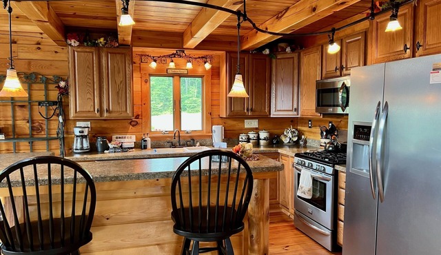 Adventure awaits at this log home with a spectacular view!