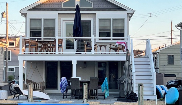 Lagoon front 3 bedroom home in OB2- walk to beach {top floor living only}