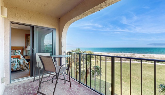 Oceanfront condo with panoramic views, shared pool, and private washer & dryer