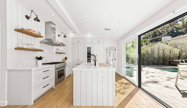 Stunning compound w/pool house features quintessential LA indoor/outdoor living