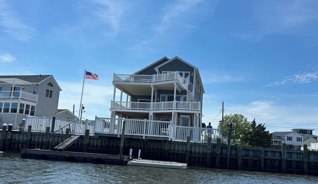 Waterfront 4-bdrm home with refuge views and dock on Mystic Island sleeps 9-10