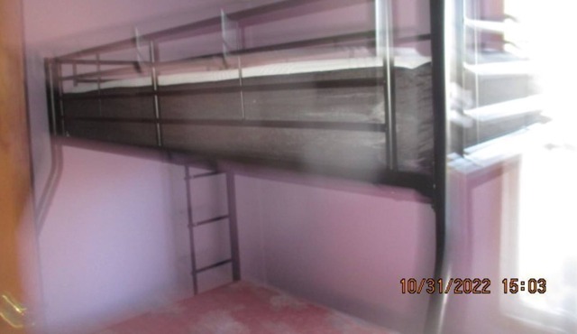 Wooded acre, attached garage plus attached lean-to.