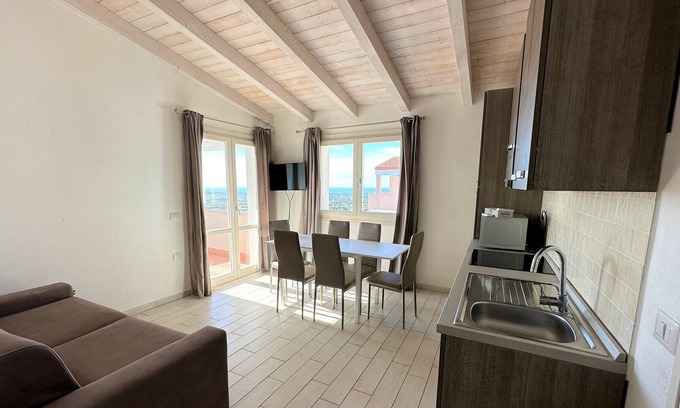 Badesi Apartment | Attic three-room apartment with panoramic sea view, shared swimming pool and parking space