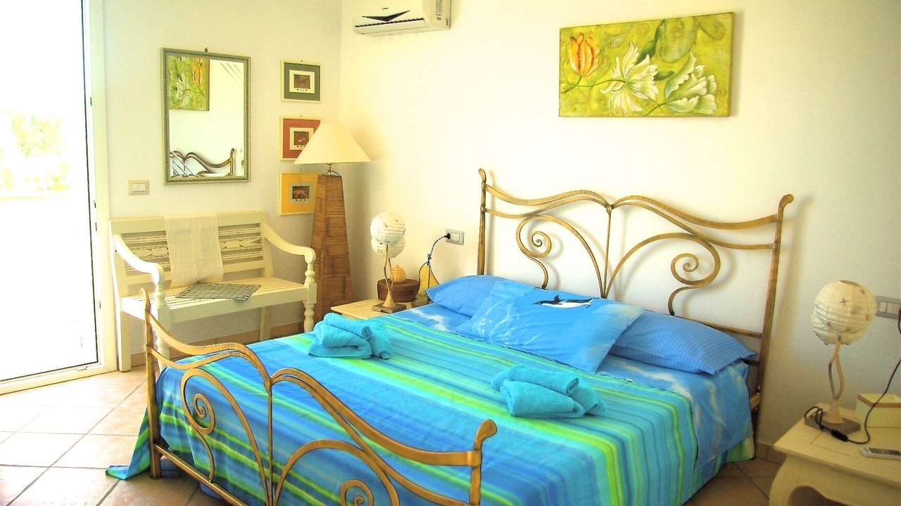 Photo of Bedroom in Is Solinas