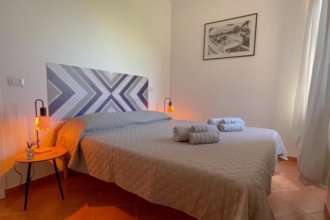 Photo of Bedroom in Lido di Capo Portiere